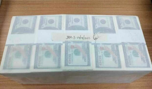 六旬男子试图兑换50万假美钞被捕