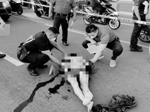 菲律宾马尼拉市临近总统府的Mabini大桥上发现一名头部中弹并被车辆碾...